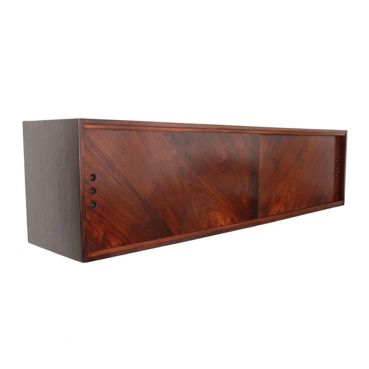 A beautiful Brazilian shelf in solid Rosewood. The doors slide and have a shelf on each side of the doors. The doors have 3 pulls on each side on the door.

Many pieces are stored in our warehouse, so please click on “Contact Dealer” button under