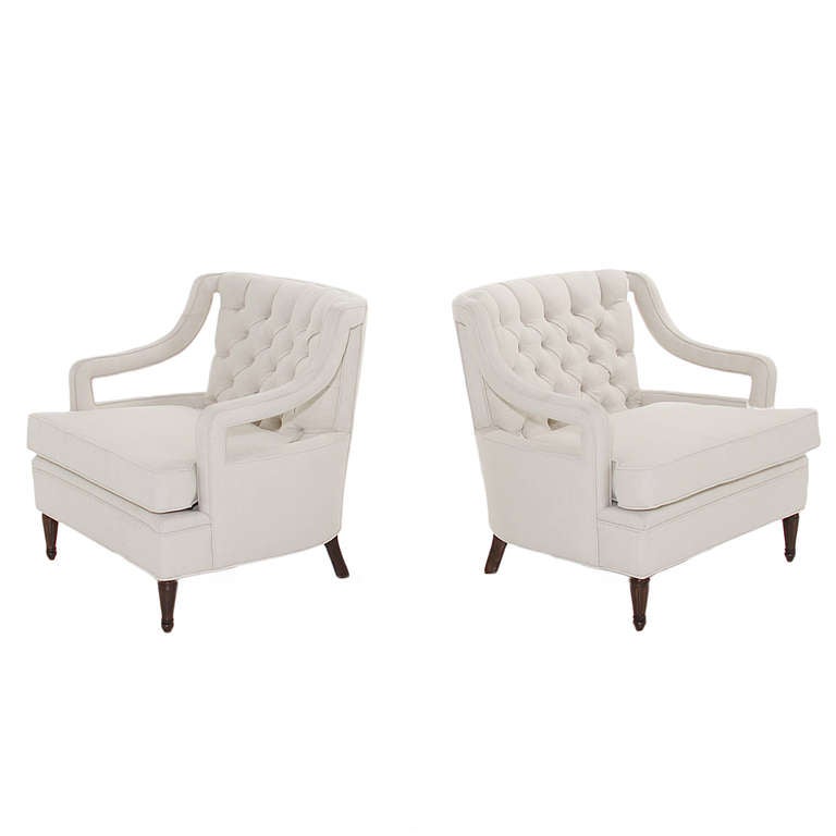 A pair of beautiful Erwin Lambeth armchairs with solid mahogany feet and ivory white linen upholstery with micro-tufting on the back.

Seat depth 19.25