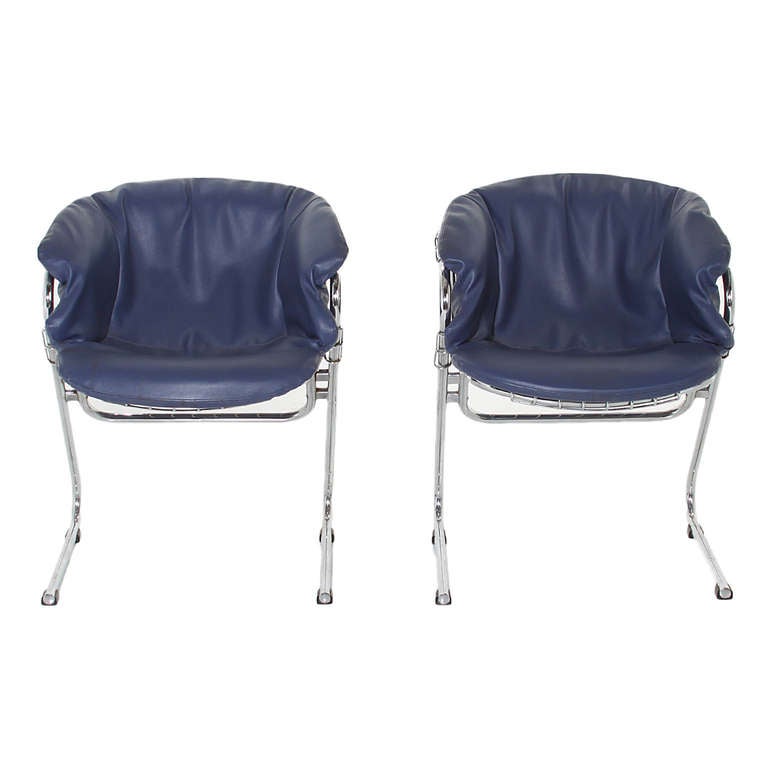 A pair of welded mesh chrome Italian design chairs upholstered in a blue leather. The seats are very curvaceous providing a snug and comfortable fit.

Seat Depth 13.25

Many pieces are stored in our warehouse, so please click on CONTACT DEALER