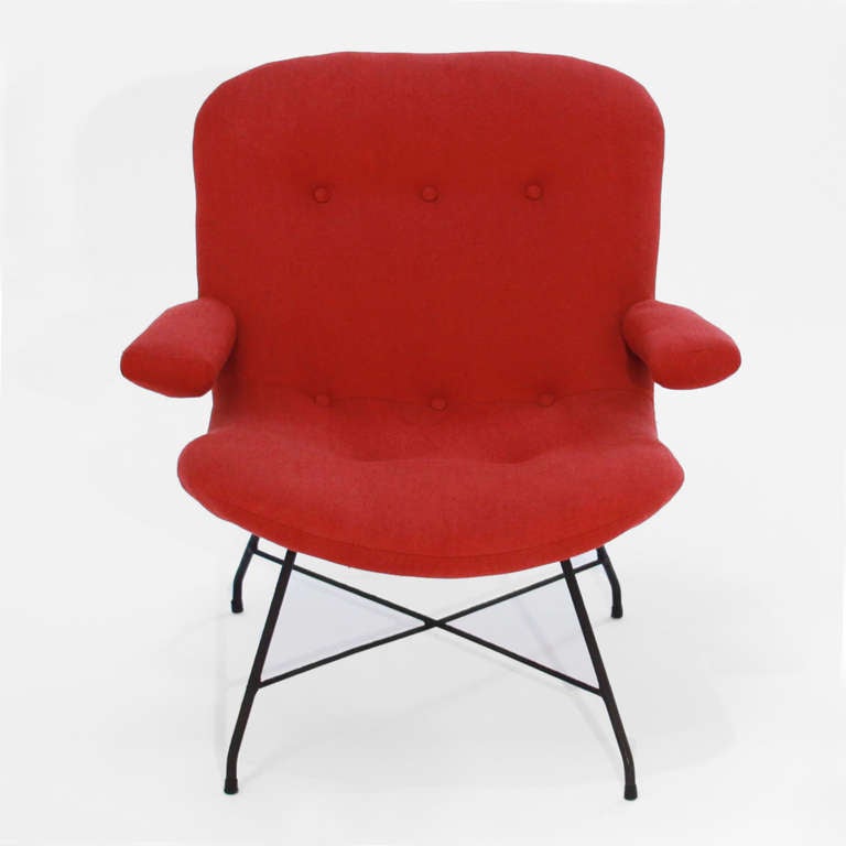 A single armchair by Brazil's Martin Eisler in the original red fabric and black iron base. 

Additional measurements:
Seat depth 17",
Seat width 22",
Arm height 18.5".

 