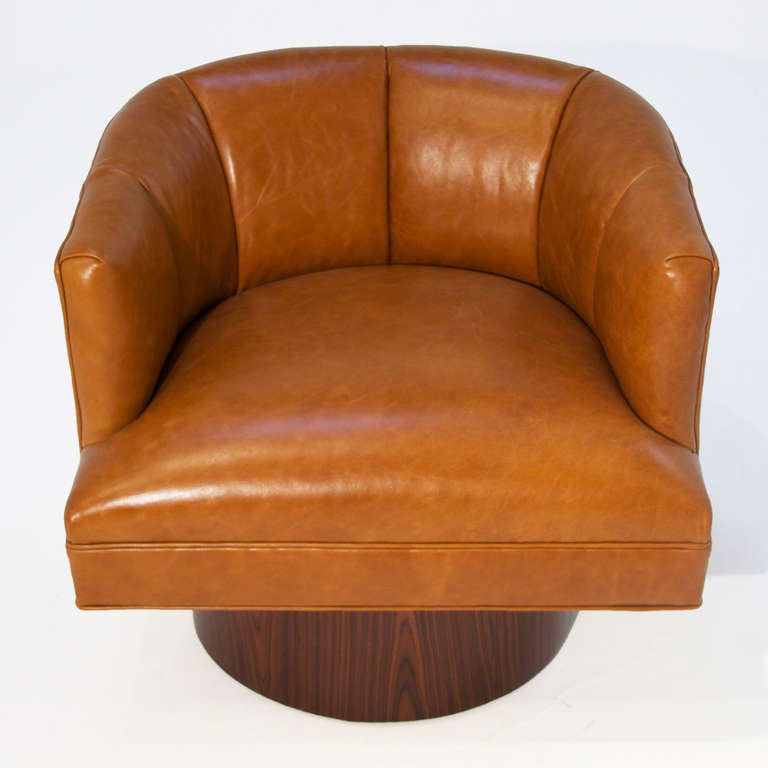 Pair Of Caramel Leather And Rosewood Swivel Chairs at 1stDibs