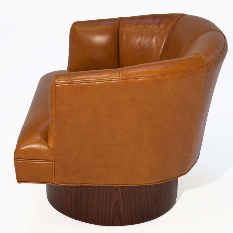 Pair Of Caramel Leather And Rosewood Swivel Chairs at 1stDibs