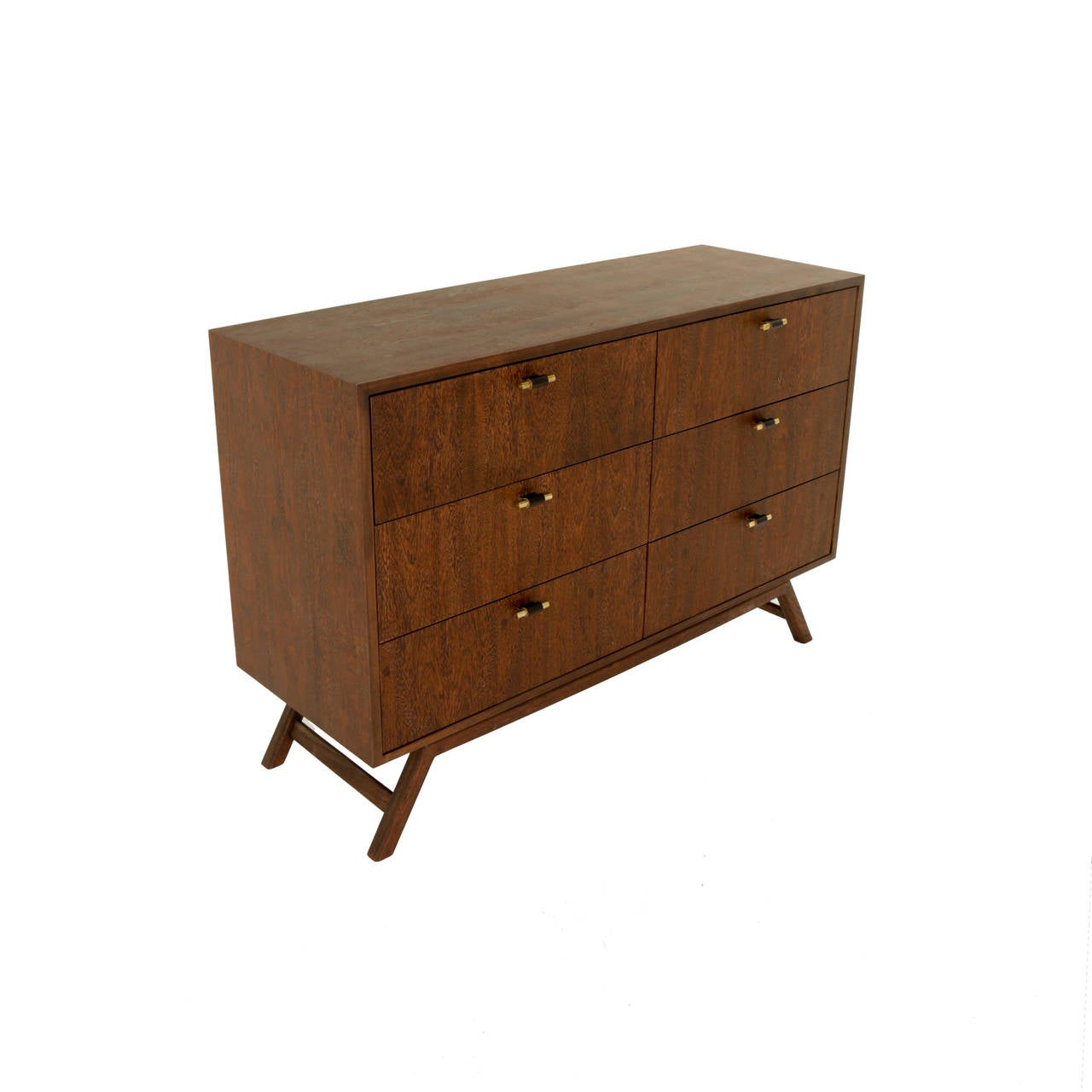A custom limited dresser made from Brazilian Sucupira wood with a solid Brazilian Sucupira wood base that appears to be floating. The 6 drawers have black leather wrapped solid polished brass pulls. The finish is a lovely hand-rubbed oil
