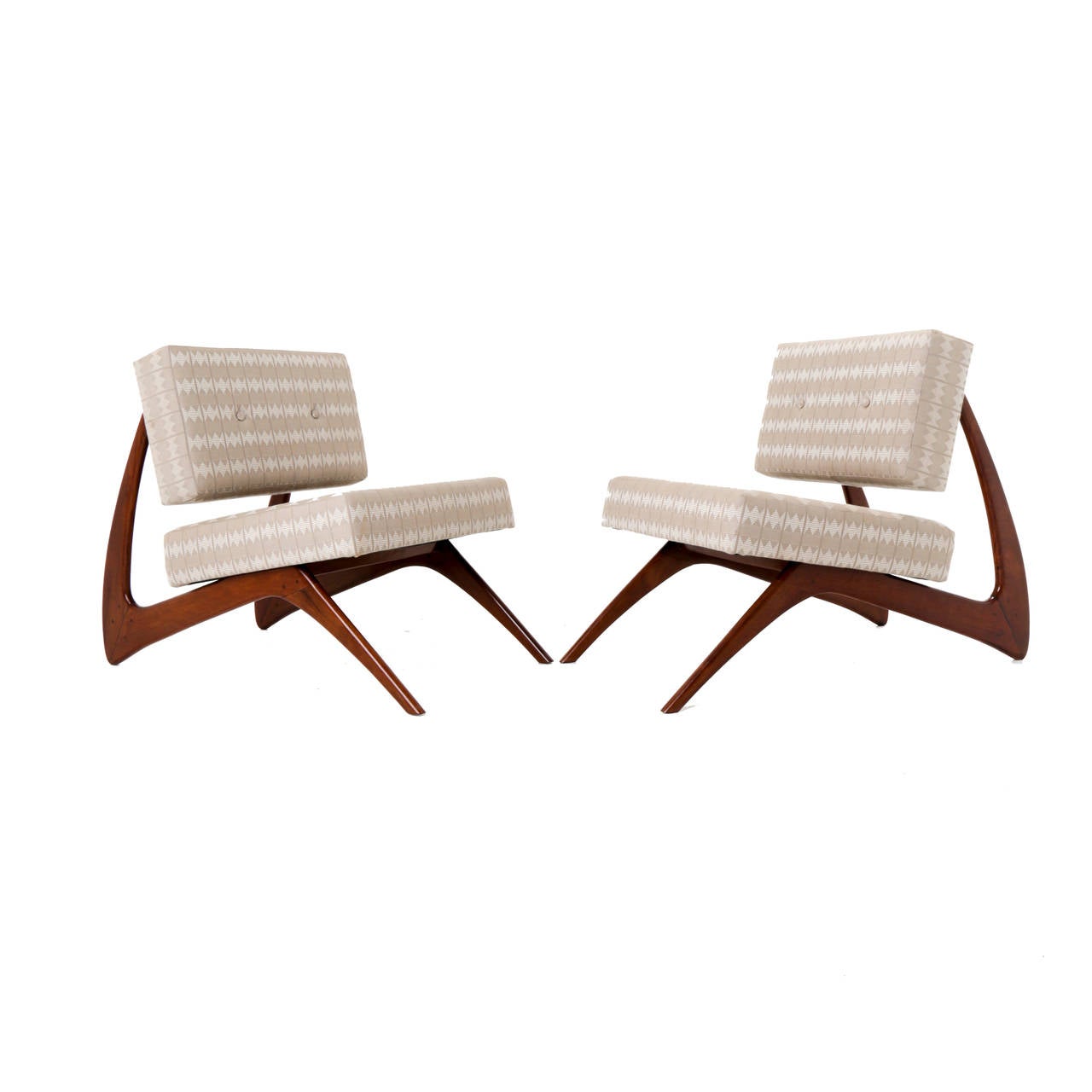 Pair of unique chairs with striking sculptural Caviuna bases and floating button backs. 

Many pieces are stored in our warehouse, so please click on CONTACT DEALER under our logo below to find out if the pieces you are interested in seeing are on