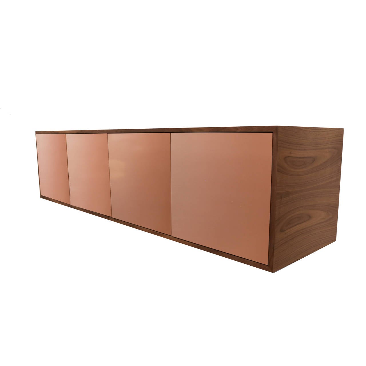 A simple yet impactful floating credenza by Thomas Hayes Studio made from solid Walnut in Pure Oil finish and four stunning Copper doors. The interior features eight individual shelf compartments, which can be customized to suit your needs.

This