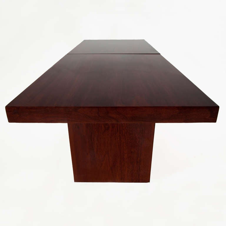 A chunky walnut coffee table that opens in the middle and extends. 
Extended length measures: 78"

Many pieces are stored in our warehouse, so please click on “Contact Dealer” button under our logo below to find out if the pieces you are