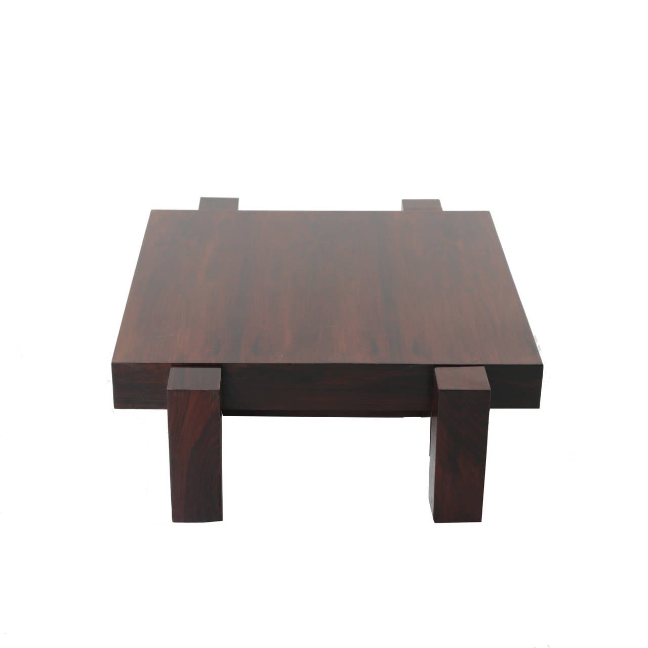 A low, Rosewood coffee table with thick rectangular legs from Brazil.

Many pieces are stored in our warehouse, so please click on CONTACT DEALER under our logo below to find out if the pieces you are interested in seeing are on the gallery floor.