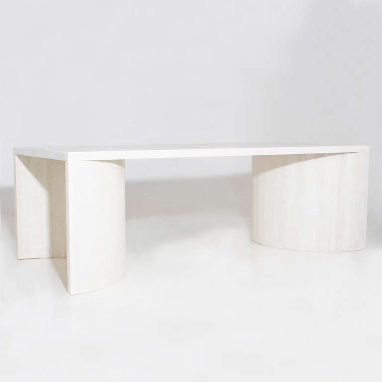 A custom dining table with two half circles in laminated bleached solid Oak opening outwards with a solid Oak top.  

This item is available for custom order and the lead time is 6-8 weeks; sometimes we are able to complete projects faster, so