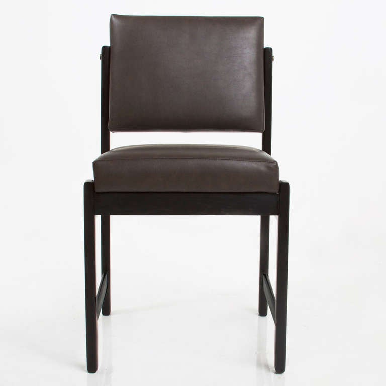 A custom, elegant solid wood dining chair available in a variety of woods and finishes with solid wood frame, pivoting back, and upholstered seat by Thomas Hayes Studio. The angle of the back creates good lumbar support. The frames are accented with