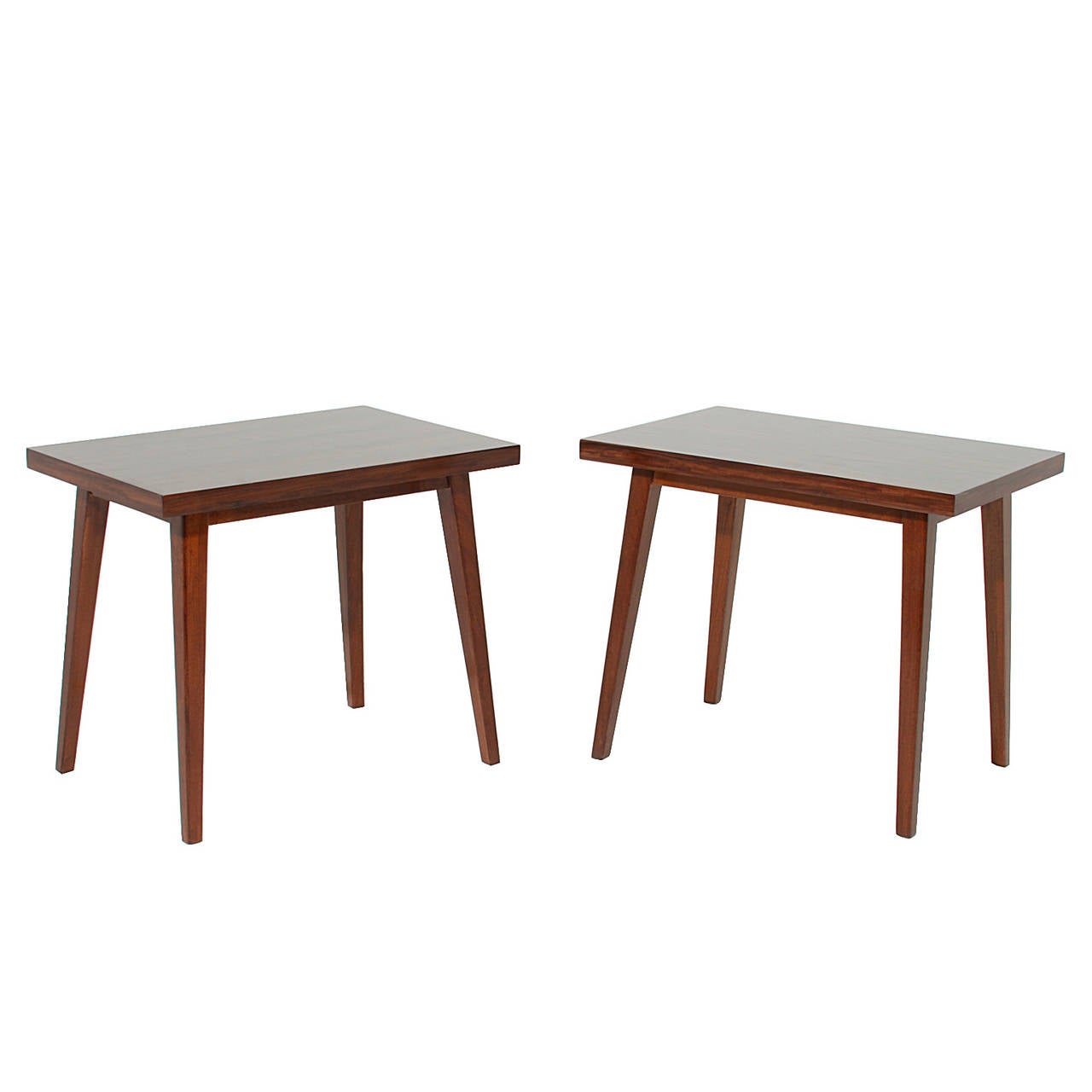 A pair of Brazilian exotic hardwood side tables with legs that pitch slightly inward.

 