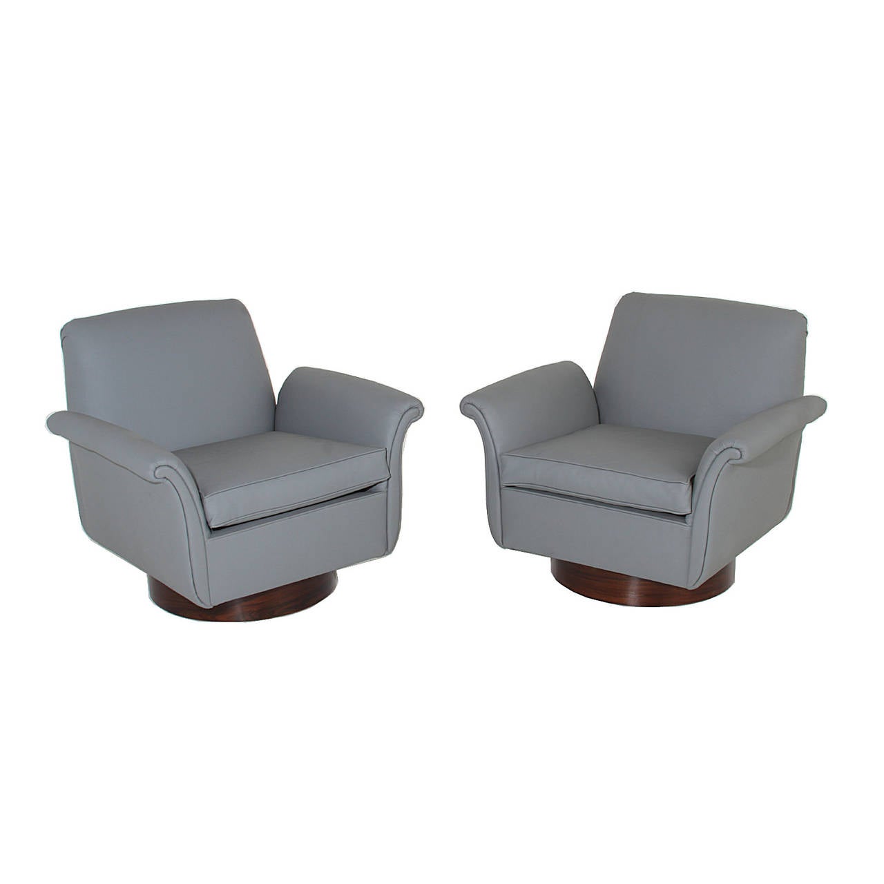 Pair of Brazilian armchairs with curved arms and cylindrical bases, newly reupholstered. Chairs sit on cylindrical Rosewood bases.

Many pieces are stored in our warehouse, so please click on 