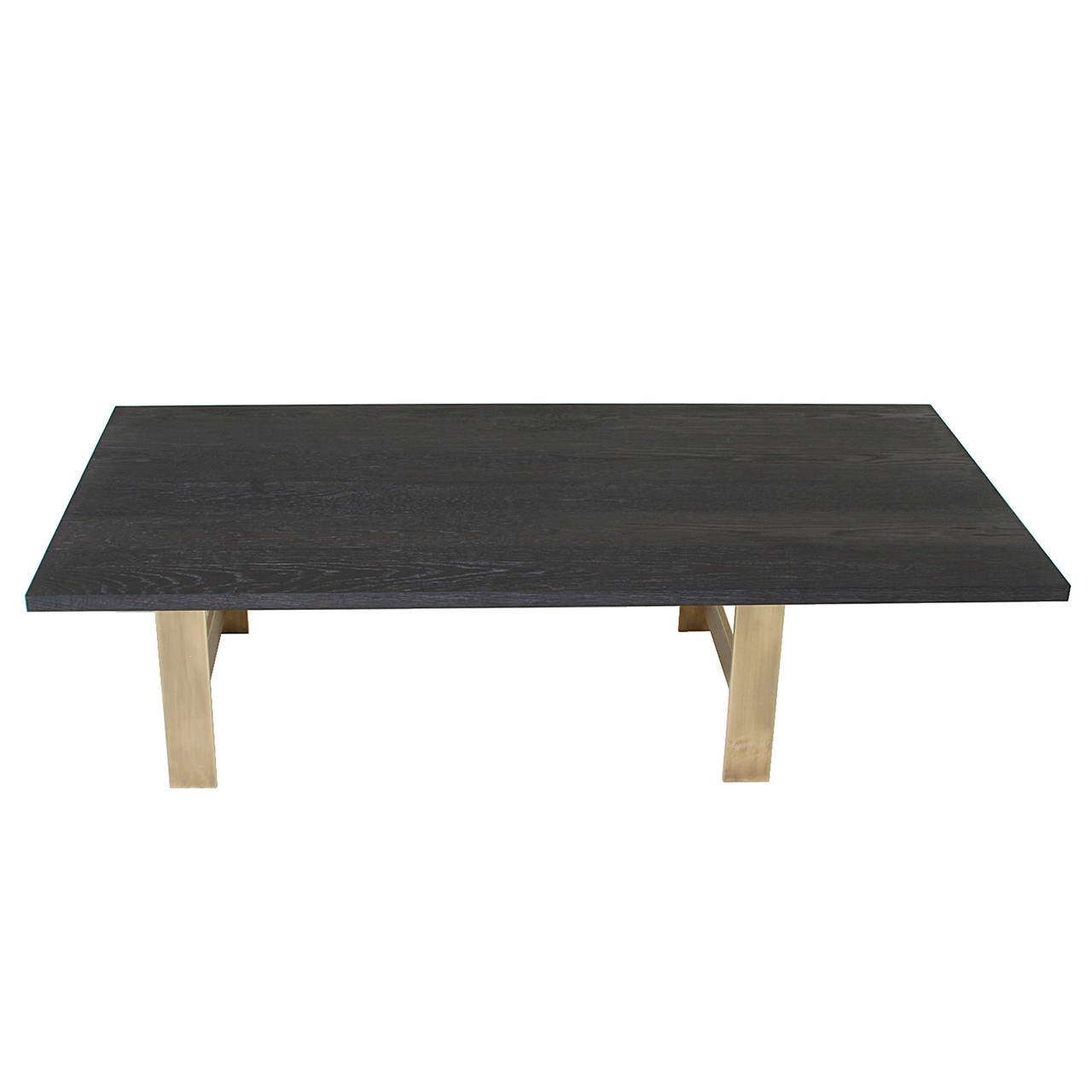 A custom stylish, asymmetrical coffee table by Thomas Hayes Studio featuring a Brass base and cantilevered ebonized and brushed solid Oak table top finished in Charcoal Oil.

This item is available for custom order and the lead time is 6-10 weeks;