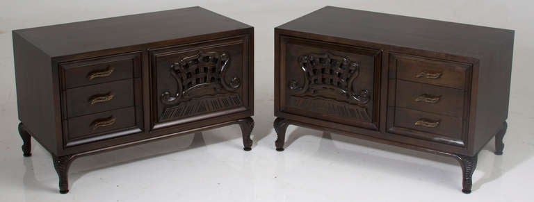 A pair of substantial and rare mahogany nightstands or side cabinets by Monteverdi-Young with delicate carved relief on the doors and original bronze pulls on the drawers. Monteverdi-Young's designers are among the most finely produced furniture