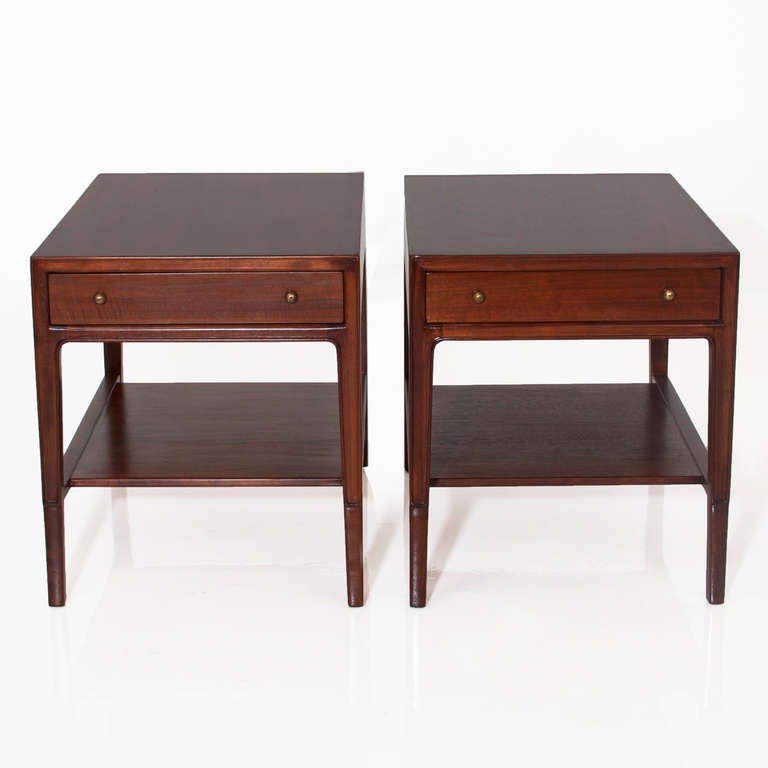 Pair of Walnut side tables or night stands by John Stuart for Janus with single drawers and floating shelves and round bronze pulls. 

Many pieces are stored in our warehouse, so please click on contact dealer under our logo below to find out if