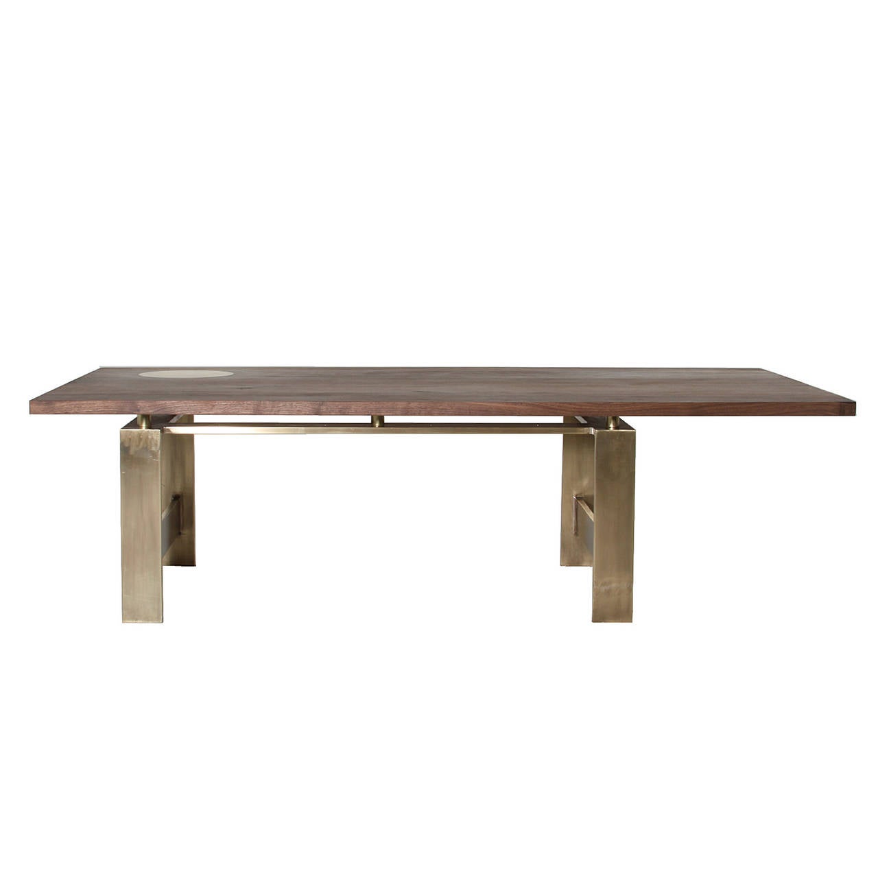 A custom stylish, asymmetrical coffee table by Tracy Hayes for Thomas Hayes Studio featuring a brass base and cantilevered, oil-finished walnut top. Walnut top features an inlay of solid brass in a perfect circle.

This item is available for