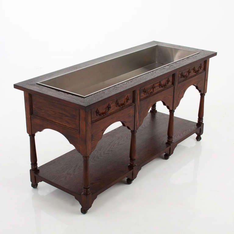 Hollywood Regency French Carved Oak Console Table on Casters In Good Condition For Sale In Los Angeles, CA