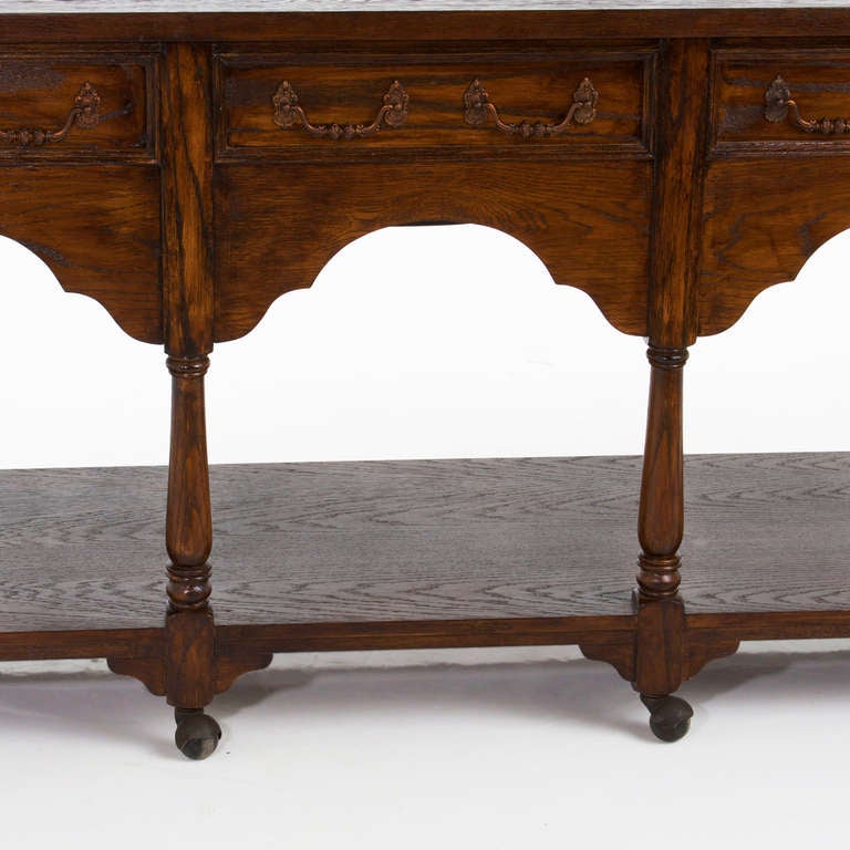 Hollywood Regency French Carved Oak Console Table on Casters For Sale 4