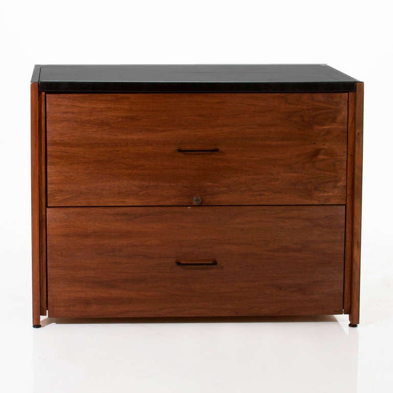 A flat file cabinet in walnut by Vista of California with inset black leather top. 

 