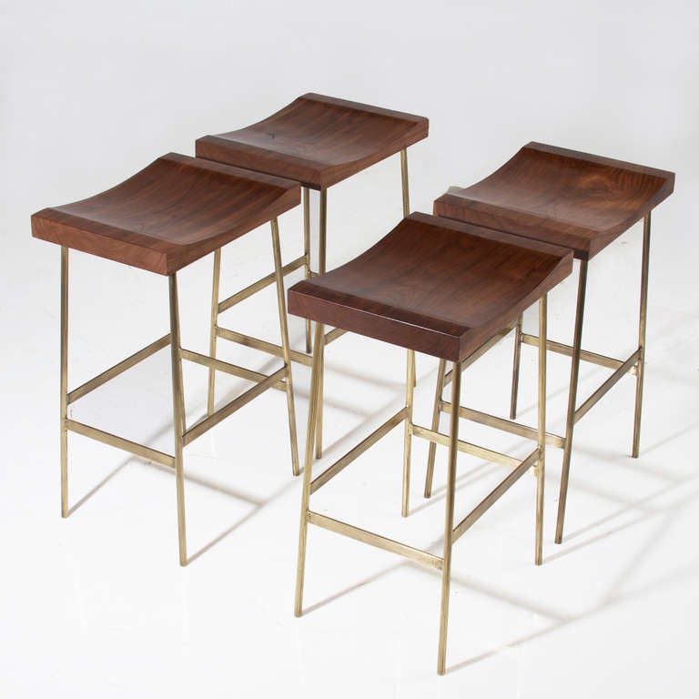 A custom version of the Bunda Bar Stool by Thomas Hayes Studio with solid brass frames and solid wood hand-carved tops. 

Please look at all pictures, as these stools are individually handmade and the solid brass has some variation. The light