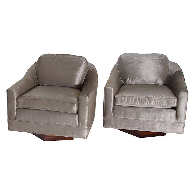 A beautiful pair Milo Baughman of swivel chairs with hexagon bases of rosewood upholstered in a beautiful gray silk velvet. 

Many pieces are stored in our warehouse, so please click on 