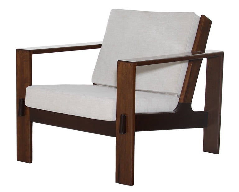 A solid Brauna wood frame arm chairs with cream linen cushions from Brazil. Has been finished in satin Lacquer with its natural color. 

Seat depth measures 22