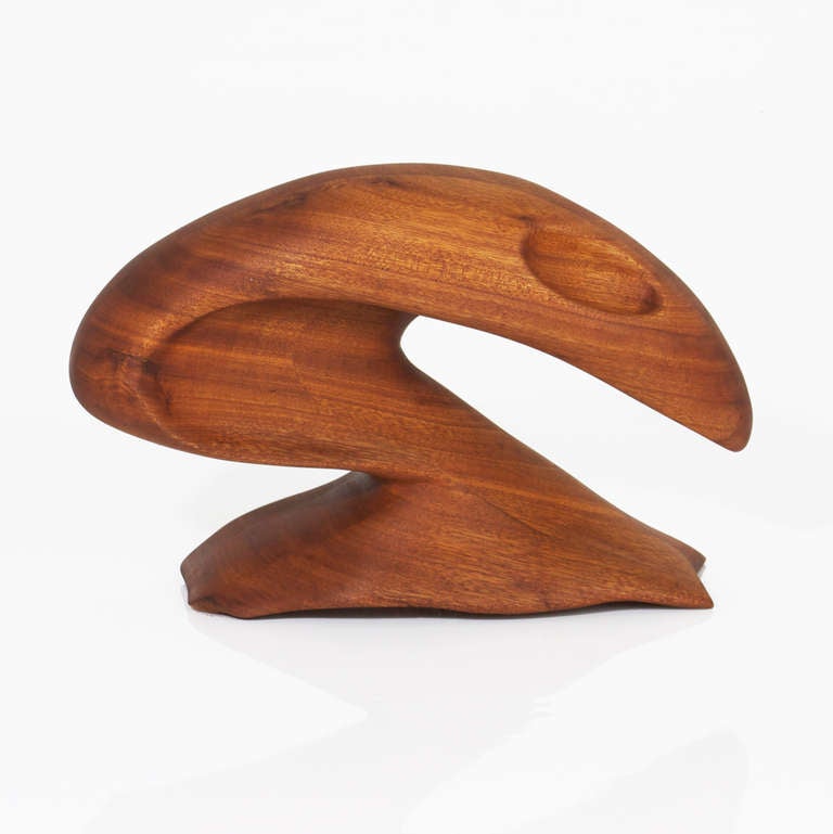 California Craftsman Revolutionary Vintage solid Teak sculpture with a form vaguely representing a head with eyes in its organic shape. Signed 