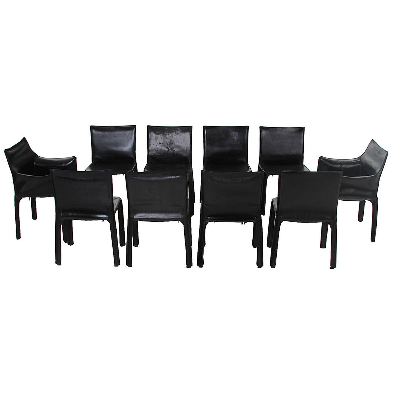 A beautiful set of eight dining chairs and two head chairs from Brazil. The chairs are very simply designed and have an elegant look. The chairs are upholstered in an aged leather and have a zipper underneath to remove the leather.

These chairs