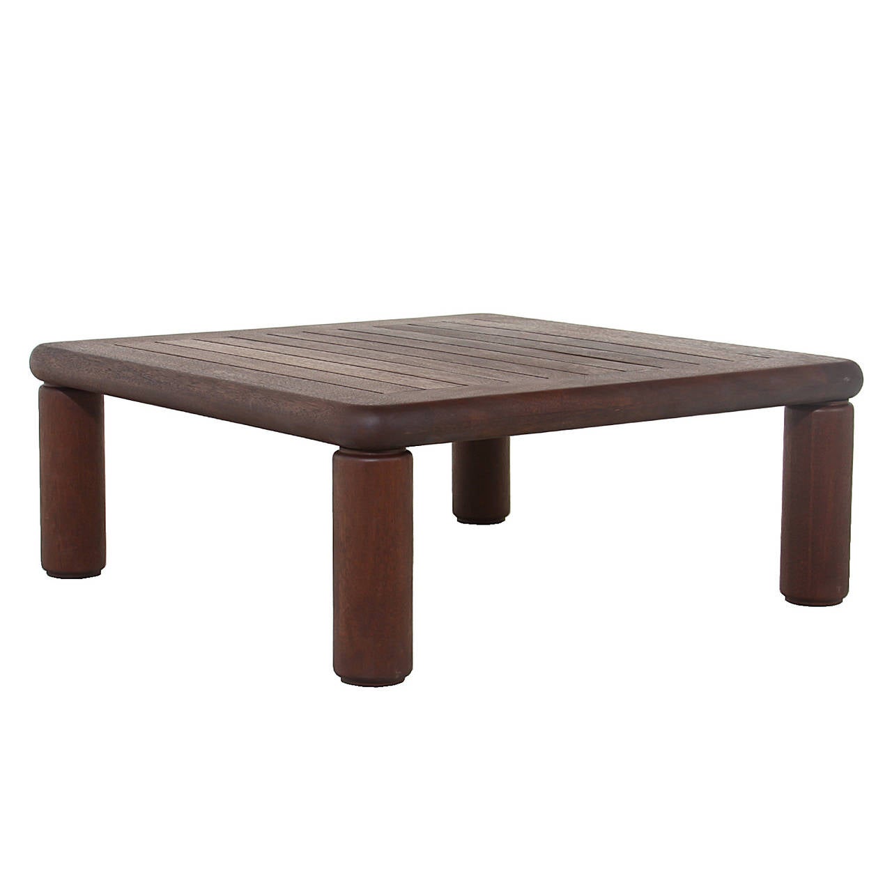 A beautiful solid Honduran Mahogany coffee table by California designer Sherill Broudy with an oil finish. There are four solid wood legs that are rounded in shape and the top is slatted creating a beautiful design element. Sherrill Broudy was one