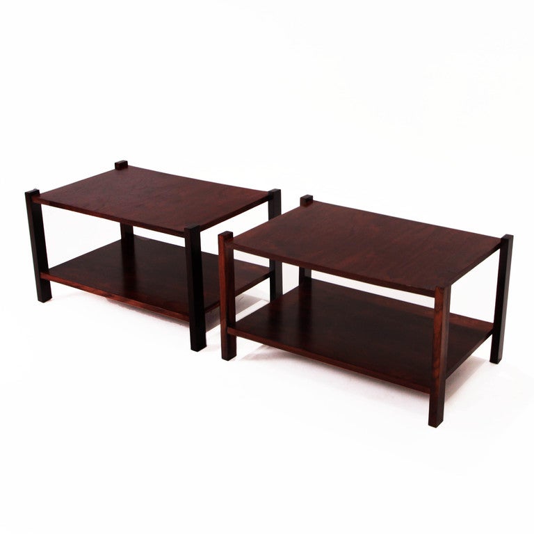 Rosewood side or end tables from Brazil each with a double shelf-platform, and with beautiful wood grain.

 