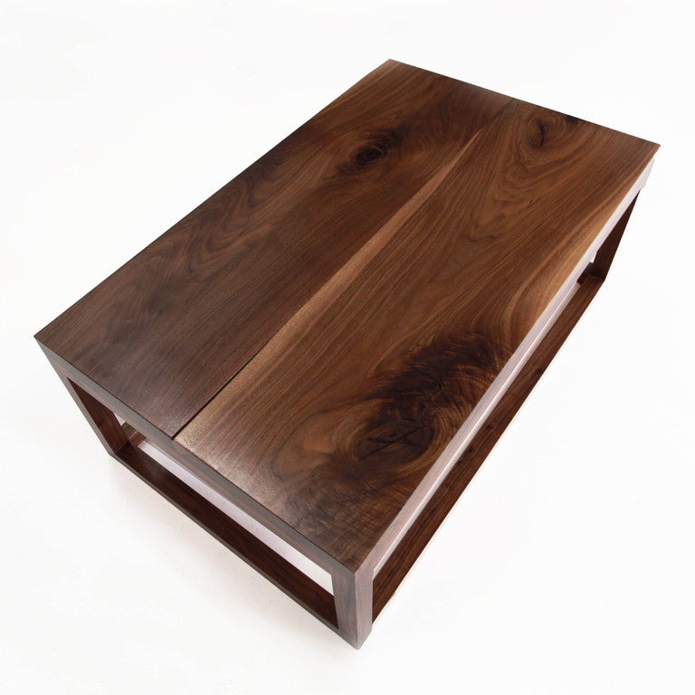 A very sturdy solid Walnut coffee table by Thomas Hayes Studio. The walnut has extensive knotting and character. It is unstained and sealed with a natural, clear sealant.

This item is available for custom order and the lead time is 6-8 weeks;