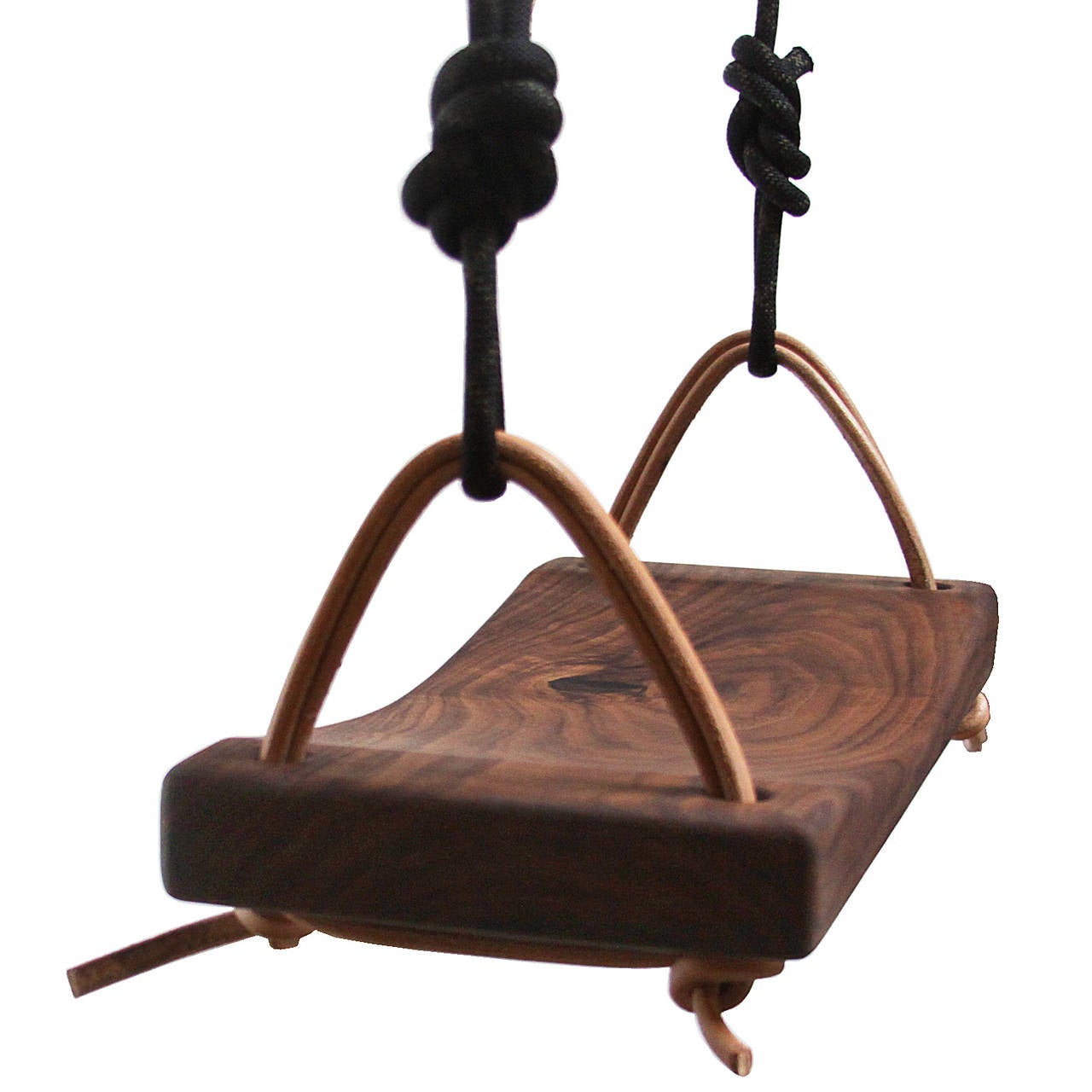 A unique solid walnut swing with leather and paracord strapping. This beautiful piece can be used indoors and is an elegant swing for a child or adult to play with.

WOOD OPTIONS:
Solid Walnut, Oak


FINISH OPTIONS:
Satin Lacquer in Natural,