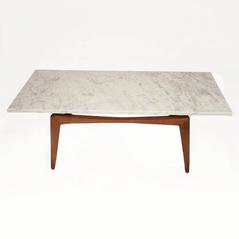 Brazillian Freijo and marble coffee table.  The design is elegant and polished, yet sturdy and very practical. Has a definite Italian influence.  In the manner of ( but not by ) Scapinelli of Sao Paolo.
Many pieces are stored in our warehouse, so