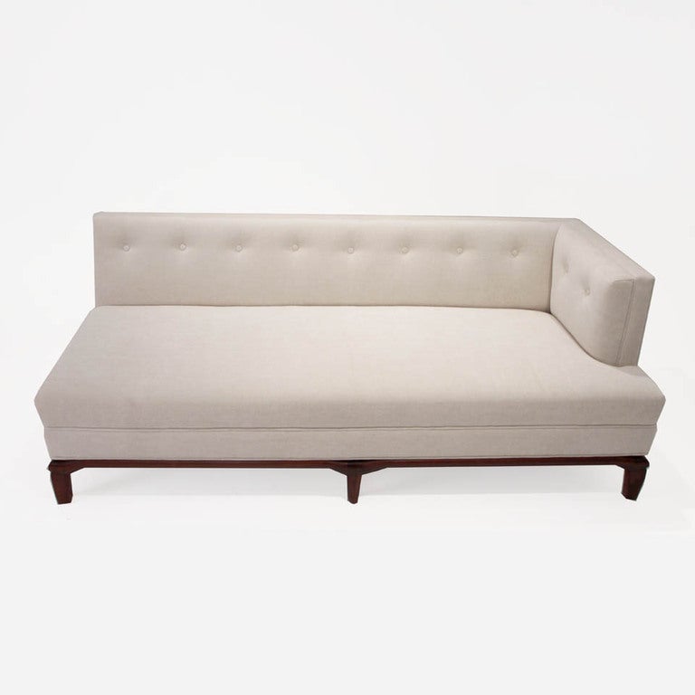 Biscuit tufted custom chaise sofa by Thomas Hayes Studio.  The sofa has a solid Walnut base and elegantly tapered legs. The cushions have been upholstered in a high quality off white linen. This particular sofa is sold but we can make another per