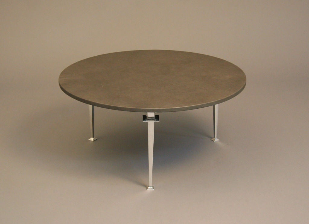 Solid aluminum legs, leather top.  This coffee table was designed and produced by Paul Laszlo.  The aluminum legs have been polished and the leather has been replaced.

Many pieces are stored in our warehouse, so please click on CONTACT DEALER