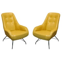 Pair of tan leather lounge chairs by Martin Eisler