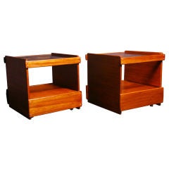 Pair of rolling glass top side tables by Sergio Rodrigues