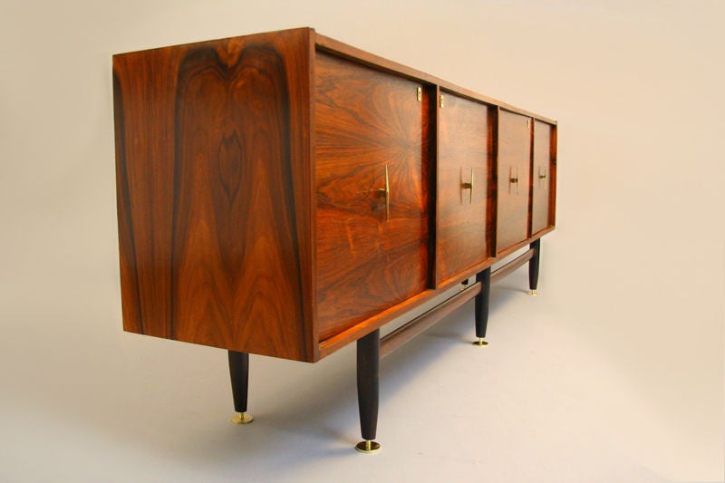 Beautiful Brazilian Rosewood cabinet with distinctive grain pattern and original brass keyholes, pulls and feet. Signature square Brazilian look upgraded with exceptional hardware. Refinished with hand rubbed French polish to best reveal the aged