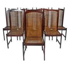 Set of 8 Solid Rosewood caned dining chairs by Celina