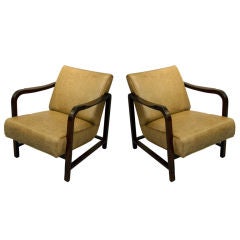 Pair of leather and mahogany Dunbar arm chairs
