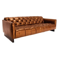 Tufted gold leather sofa