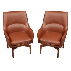 Pair of leather and walnut lounge chairs by Jens Risom