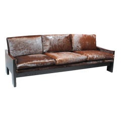 Ebonized oak, rosewood and brown hair on hide sofa