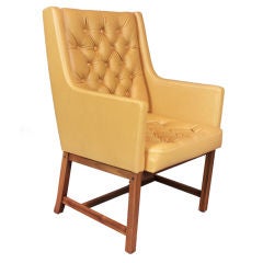 Tufted leather and teak arm chair by Jan Eksilius