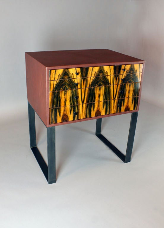 A vintage jewelry chest/side table by Thomas Hayes Studio with Pau-Brazil wood, bronze steel base and covered in a textured rich burgundy leather. Drawers are made with the highest quality soft-close mechanism.

This item is available for custom