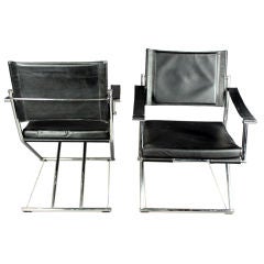 Pair of rocking black leather and chrome side chairs