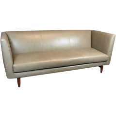 Large scale angular leather and rosewood sofa from Brazil