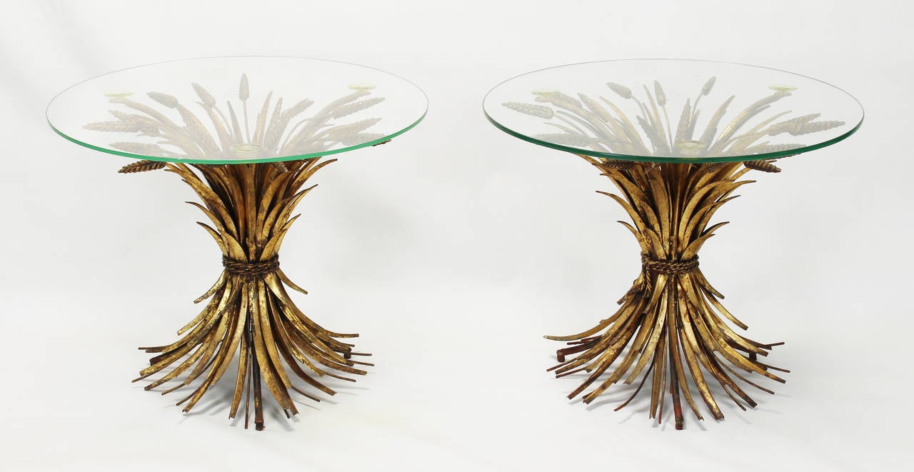 A pair of Mid-century Italian gilt decorated sheath of wheat side tables with glass tops.