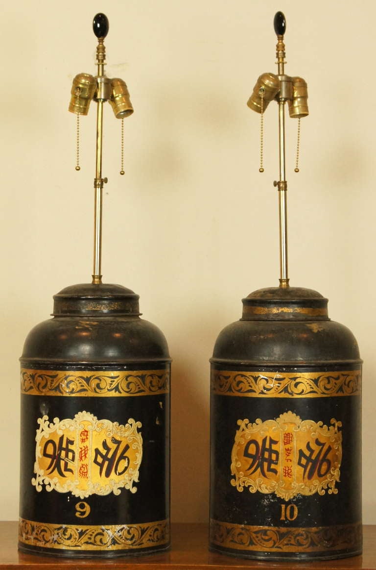 A pair of 19th century English tole tea canisters made by Parnall & Sons in Bristol, England, converted into lamps some time ago.