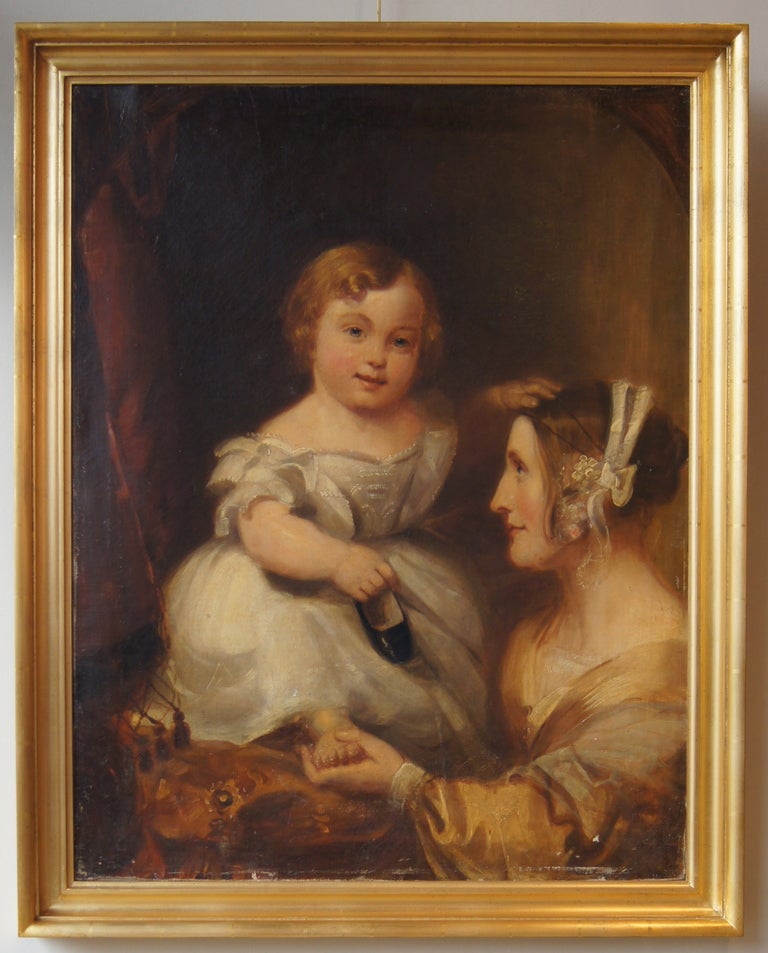 A large beautifully painted oil on canvas portrait of a mother and child in the style of Joshua Reynolds dating from the early 19th century in later giltwood frame.