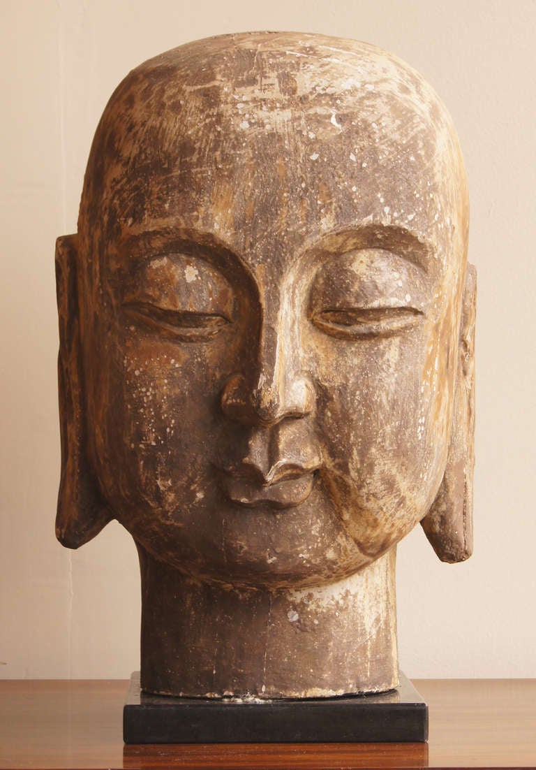 carved wooden buddha head